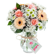 Inspired by the bright, peaceful mornings of Chertsey, this exuberant bouquet features a collection of soft peach and blush-toned blooms presented in a clear glass vase, set before a white backdrop that magnifies their freshness. At the core, delicately layered peach-pink roses spiral open, radiating warmth like sunbeams over Abbeyfields Green. Cheerful peachy-orange gerberas sit gracefully nearby, accented with bold brown centres that lend a playful touch. White chrysanthemums with vivid lime hearts and cloud-like baby's breath interweave throughout, creating a soft, voluminous effect and refreshing brightness. Slender eucalyptus leaves, in shades of deep woodland green, are scattered for gentle fragrance and texture, echoing riverside walks along the Thames Path. The arrangement is tied at the vase's neck with simple twine, from which a crisp white tag hangs, ready for a custom message. Each element is the mark of skilled local floristry, perfect for a Chertsey birthday, congratulatory moment, or just to show appreciation and uplift a friend's day.